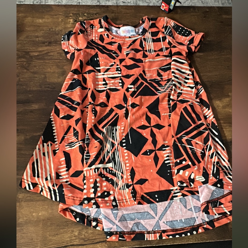 LuLaRoe Kids Dress in Orange and Black Pattern